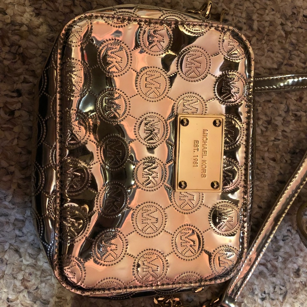 Michael Kors Gold Small Going Out Bag.